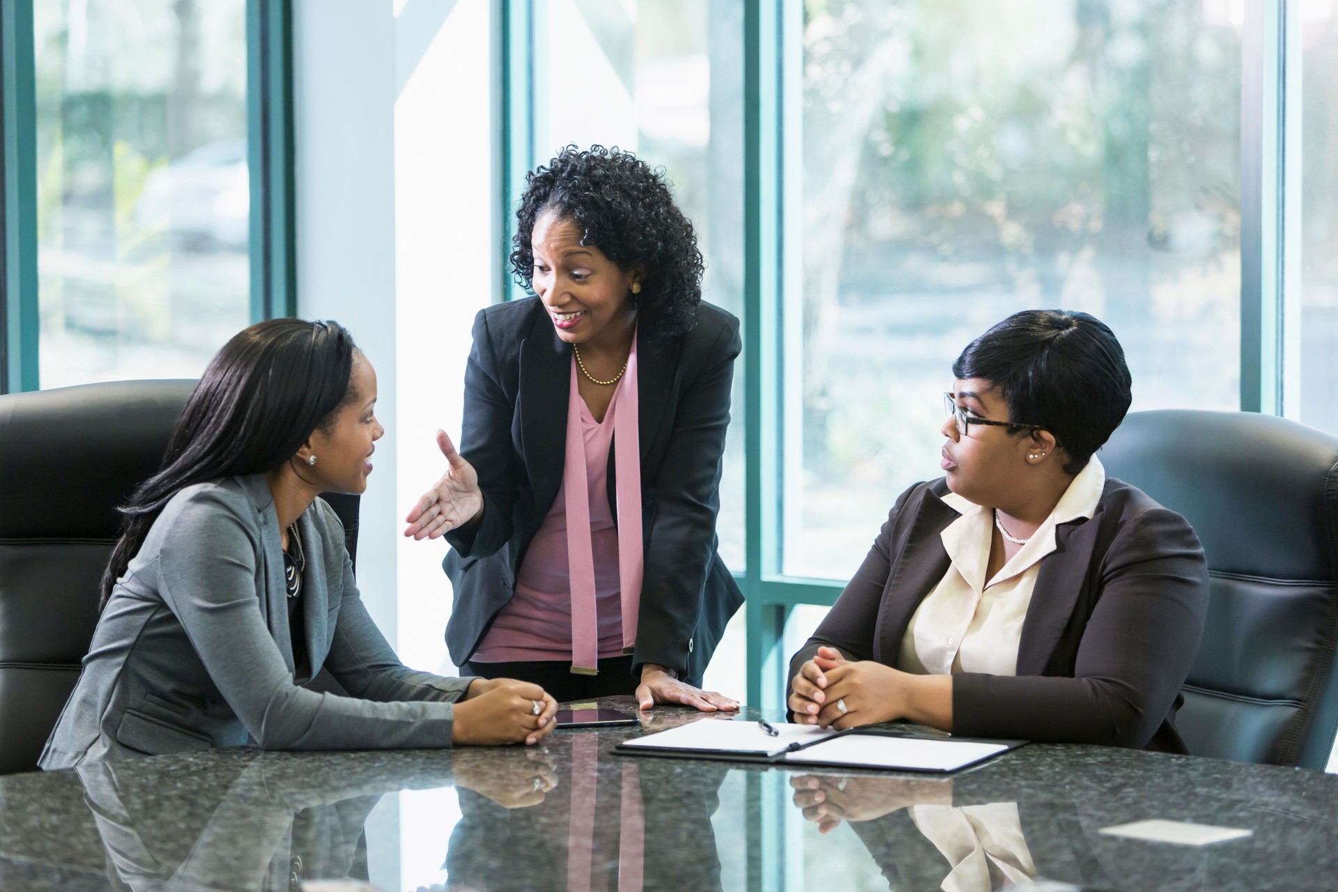 Three black women in business meeting